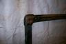 Corner braces on brass windshield